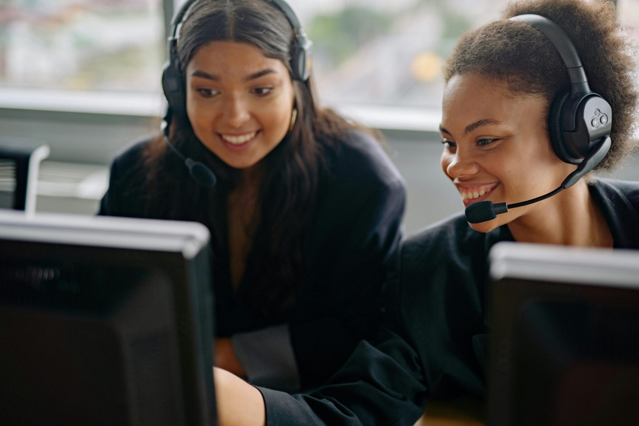 Two women working at the front desk